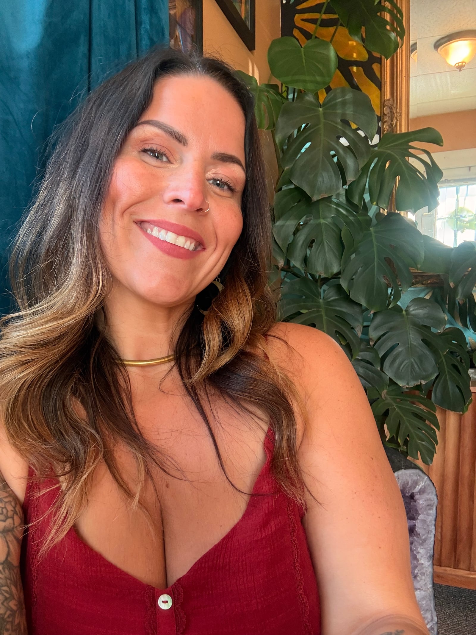 Kate Gajewski smiling in The Lightness of Being healing space