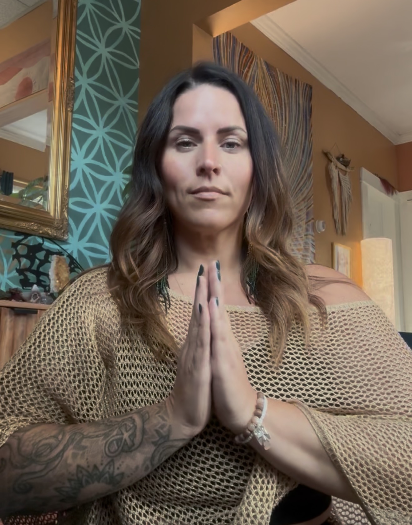 Kate Gajewski centered with her hands at her heart