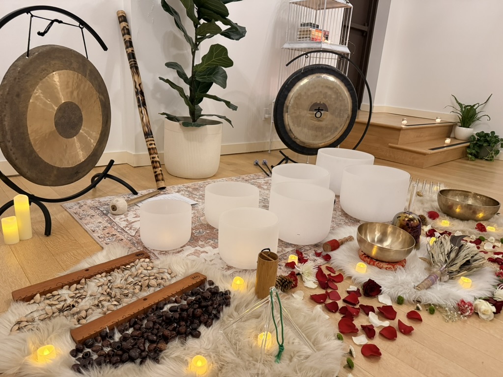 The complete sound instrument arrangement at Sanctuary+Health with gongs, bowls, flowers and candles