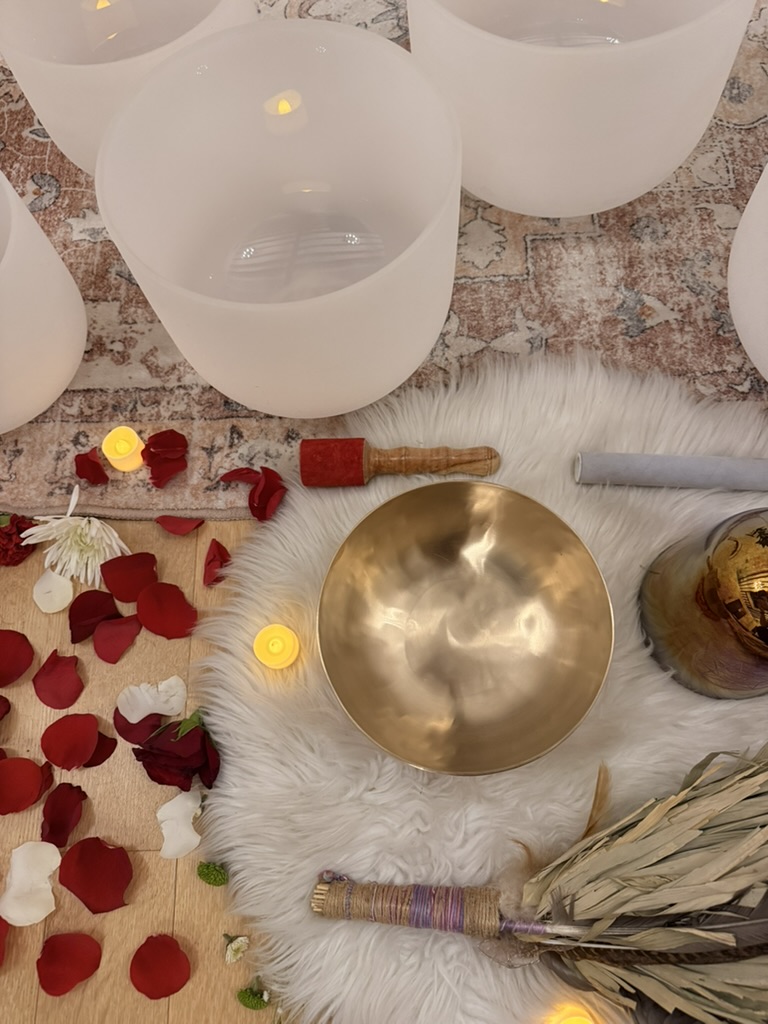 Singing bowls, flowers, candles and sound instruments arranged at Sanctuary+Health